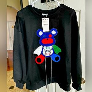 Black sweatshirt with nice colored Bear in the front. Size M. NWT.